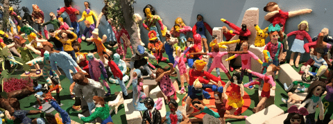 A diorama of many painted clay figures.
