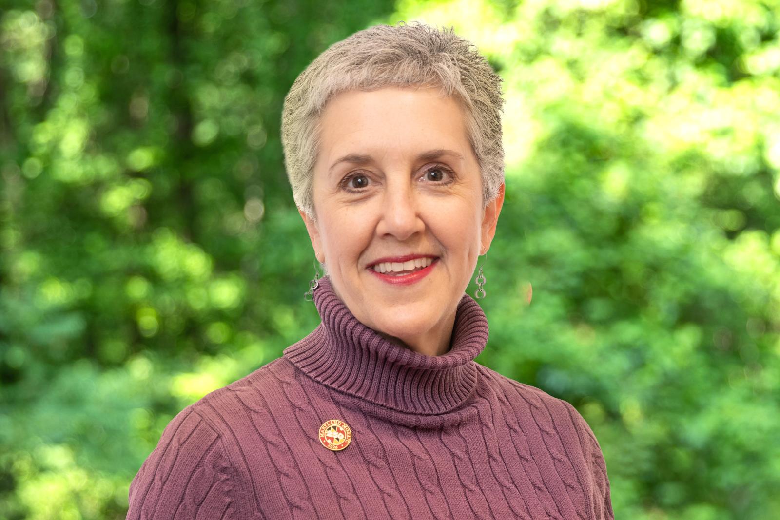 Headshot of Senator Cheryl Kagan. Smiling woman with short, grey hair and a maroon sweater.